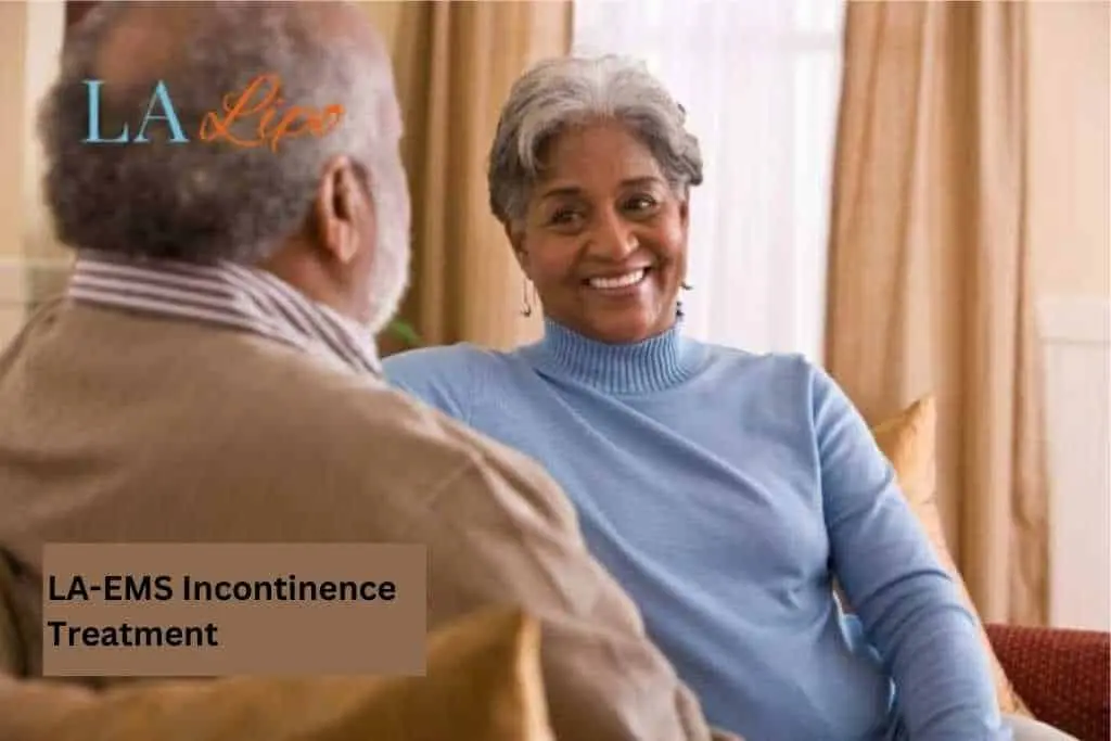 Couple sat smiling at each other - LA-EMS treatment Buxton
